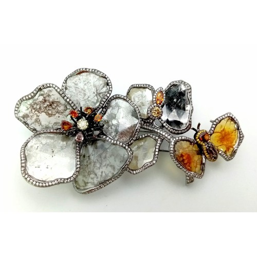 53 - A SHOW STOPPING DIAMOND BROOCH IN THE FORM OF FLOWERS AND A BUTTERFLY .   32.1gms   9cms in height.