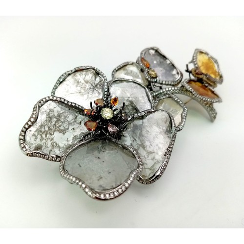 53 - A SHOW STOPPING DIAMOND BROOCH IN THE FORM OF FLOWERS AND A BUTTERFLY .   32.1gms   9cms in height.