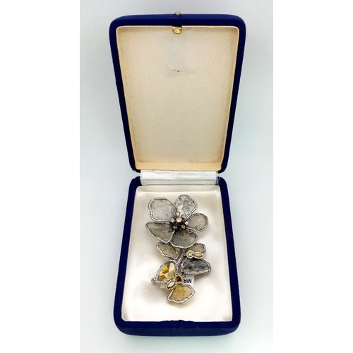 53 - A SHOW STOPPING DIAMOND BROOCH IN THE FORM OF FLOWERS AND A BUTTERFLY .   32.1gms   9cms in height.