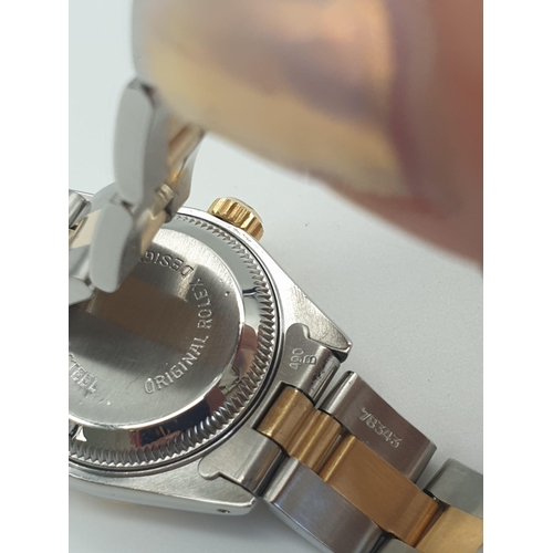 158 - A Rolex Oyster Perpetual Datejust Ladies Watch. Bi-metal strap and case - 26mm. Silver-tone dial. Au... 