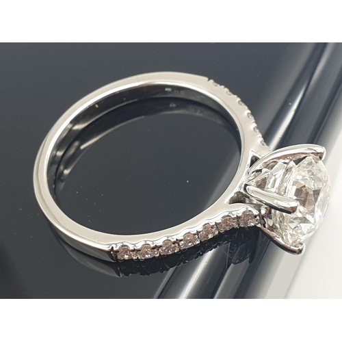 51 - A FABULOUS 2.01ct DIAMOND RING SET IN PLATINUM WITH DIAMOND SHOULDERS .   5.3gms   size N