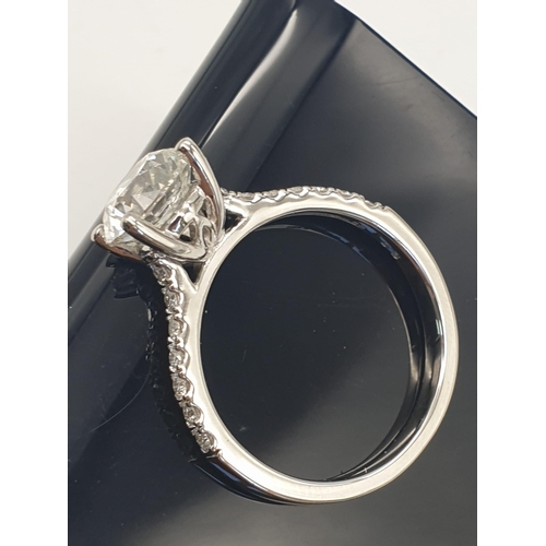 51 - A FABULOUS 2.01ct DIAMOND RING SET IN PLATINUM WITH DIAMOND SHOULDERS .   5.3gms   size N