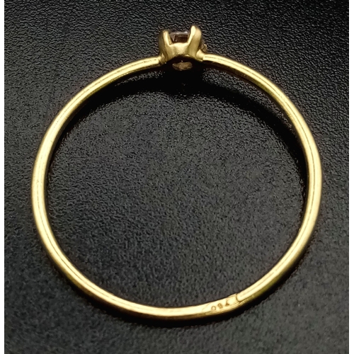 735 - An 18K Yellow Gold Diamond Solitaire Ring. 0.10ct. Size M.
0.85g total weight.