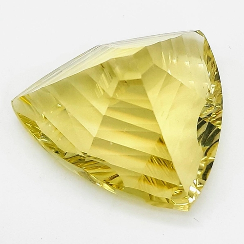 112 - An exceptionally beautiful, lime green-yellow, large (31 carats), CITRINE. Customised, trillion cut,... 