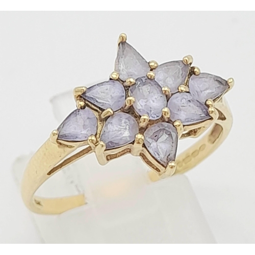 644 - A 9K Yellow Gold Amethyst Floral Decorative Ring. Size S. 2.4g total weight.