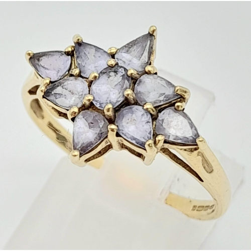 644 - A 9K Yellow Gold Amethyst Floral Decorative Ring. Size S. 2.4g total weight.