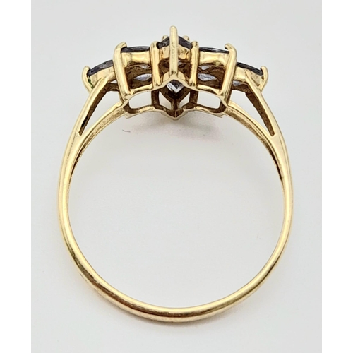 644 - A 9K Yellow Gold Amethyst Floral Decorative Ring. Size S. 2.4g total weight.