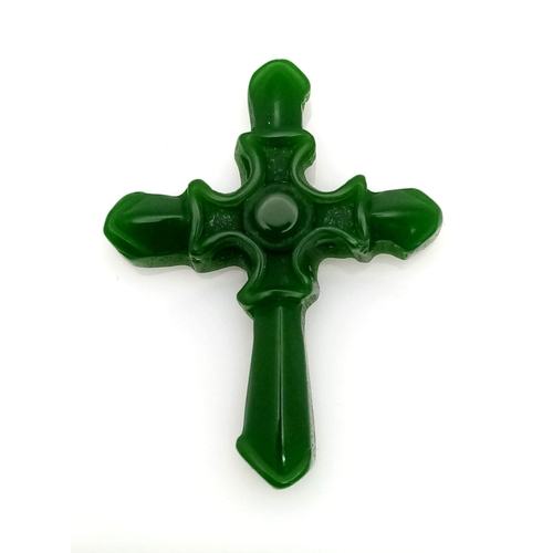 437 - A Green Jade Cross Pendant.  5cm x 4cm.