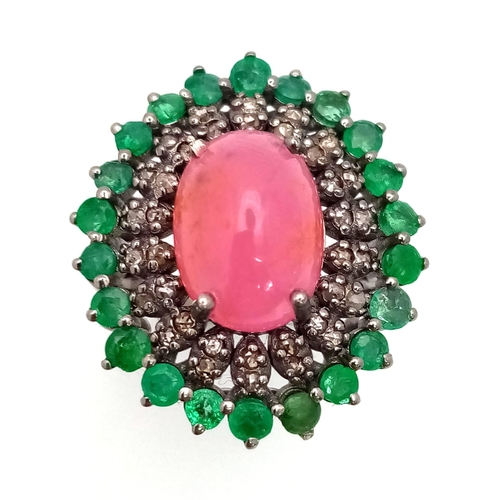 440 - A 6.70ct Ruby Cabochon Ring with 1.80ct Emerald and 0.60ct Diamond Accents. Set in 925 Silver. Size ... 