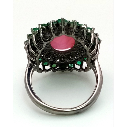 440 - A 6.70ct Ruby Cabochon Ring with 1.80ct Emerald and 0.60ct Diamond Accents. Set in 925 Silver. Size ... 