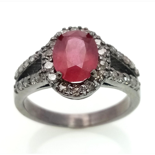 622 - A 2ct Ruby Ring with a Diamond Halo and Shoulders. Set in gunmetal 925 Silver. Size N. 3.94g total w... 