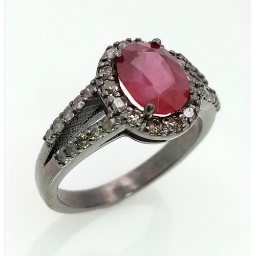 622 - A 2ct Ruby Ring with a Diamond Halo and Shoulders. Set in gunmetal 925 Silver. Size N. 3.94g total w... 
