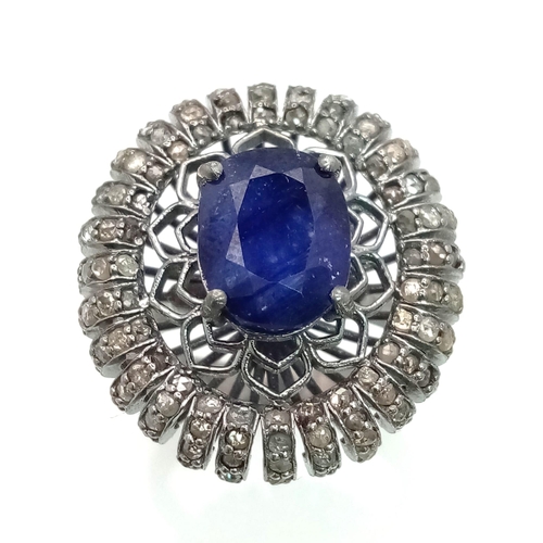 734 - A 5.40ct Blue Sapphire Ring with 1.60ct of Diamond Accents. Set in 925 Silver. Size P. Comes with a ... 
