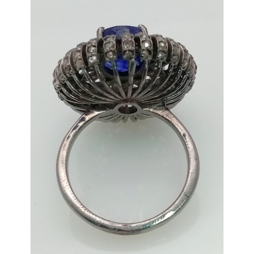 734 - A 5.40ct Blue Sapphire Ring with 1.60ct of Diamond Accents. Set in 925 Silver. Size P. Comes with a ... 