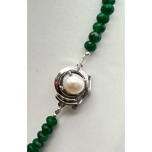 608 - A 260ct Graduated Emerald Gemstone Necklace with Pearl and 925 Silver Clasp. 46cm