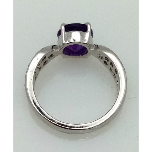 941 - An Amethyst CZ 925 Silver Ring. Size N.