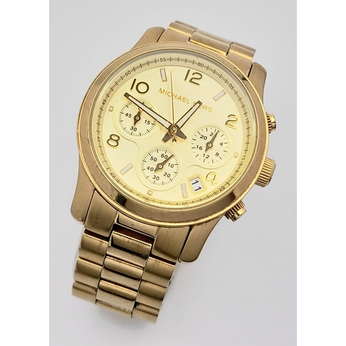 1160 - A Michael Kors Gold Plated Ladies Chronograph Watch. Gold plated bracelet and case - 38mm. Gold tone... 