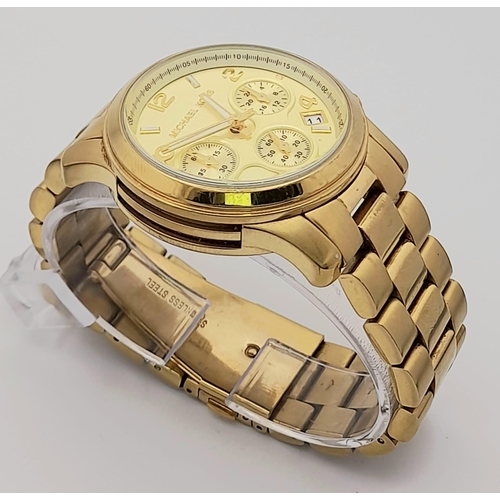 1160 - A Michael Kors Gold Plated Ladies Chronograph Watch. Gold plated bracelet and case - 38mm. Gold tone... 