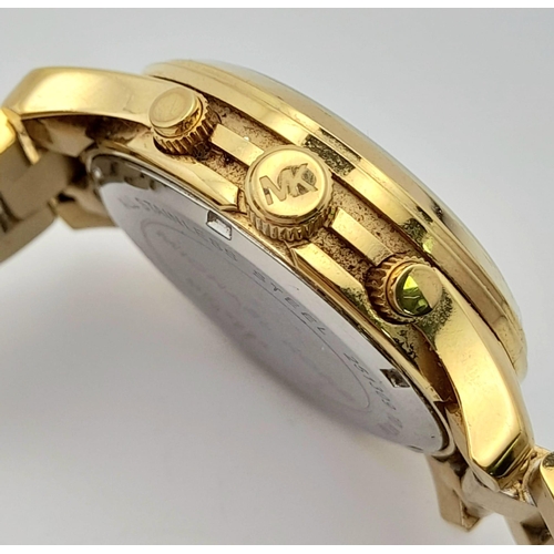 1160 - A Michael Kors Gold Plated Ladies Chronograph Watch. Gold plated bracelet and case - 38mm. Gold tone... 