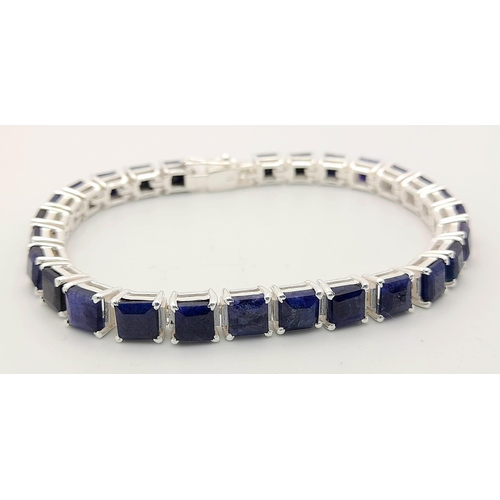 433 - A Blue Sapphire Gemstone Tennis Bracelet set in 925 Silver.
19cm. 20.3g total weight.