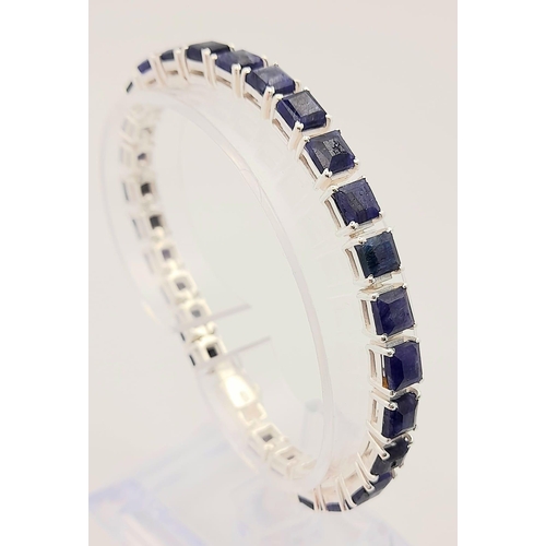 433 - A Blue Sapphire Gemstone Tennis Bracelet set in 925 Silver.
19cm. 20.3g total weight.