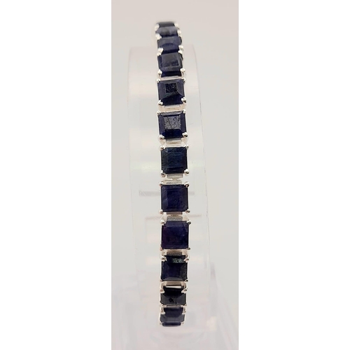 433 - A Blue Sapphire Gemstone Tennis Bracelet set in 925 Silver.
19cm. 20.3g total weight.