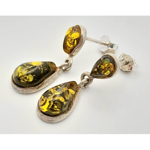 766 - A Vintage Pair of Sterling Silver Green Amber Set Pendant Earrings. Pear Cut 2.2cm Length.
