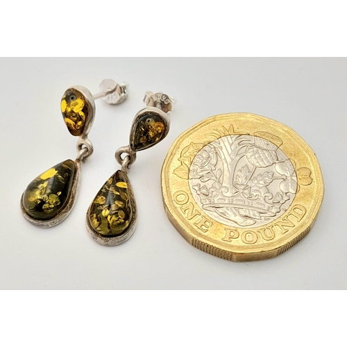 766 - A Vintage Pair of Sterling Silver Green Amber Set Pendant Earrings. Pear Cut 2.2cm Length.