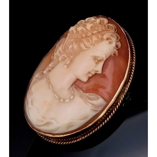 46 - An Antique Cameo Brooch. Set in 9K yellow Gold. 4cm. 12.23g total weight.