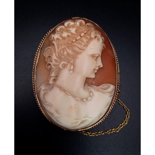 46 - An Antique Cameo Brooch. Set in 9K yellow Gold. 4cm. 12.23g total weight.