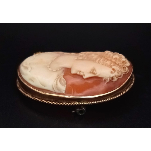 46 - An Antique Cameo Brooch. Set in 9K yellow Gold. 4cm. 12.23g total weight.