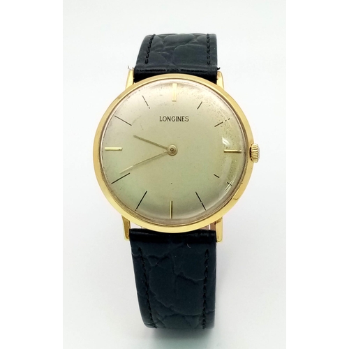722 - A Vintage Longine 18K Gold Cased Gents Watch. Black leather strap. 18k gold case - 34mm. Silver- gre... 