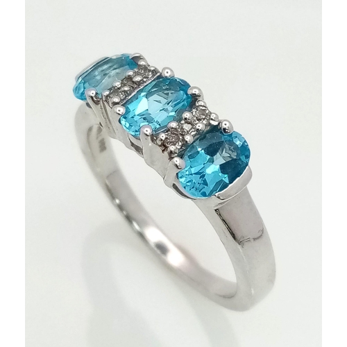 773 - New Sterling Silver Blue & White Topaz Set Ring Size P. Set with 3 Oval Cut 6mm Long Blue Topaz ... 