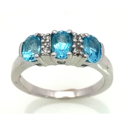 773 - New Sterling Silver Blue & White Topaz Set Ring Size P. Set with 3 Oval Cut 6mm Long Blue Topaz ... 