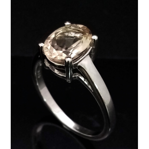 957 - A New Sterling Silver Oval Cut Citrine Ring Size R. The Citrine Measures 1cm Length and the Ring Wei... 