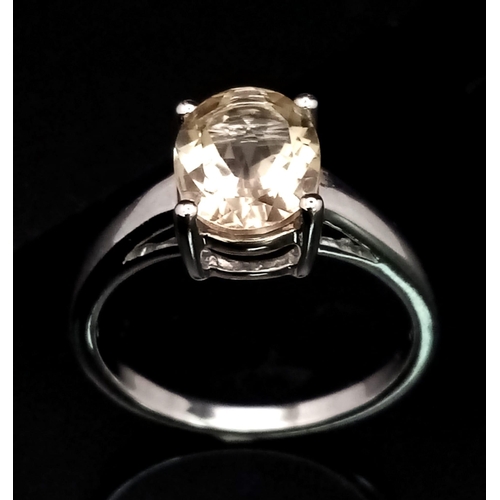 957 - A New Sterling Silver Oval Cut Citrine Ring Size R. The Citrine Measures 1cm Length and the Ring Wei... 