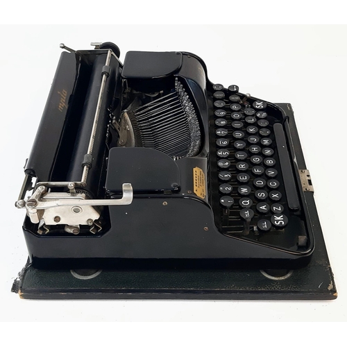 646 - A Vintage 1940s Olympia Progress Typewriter with Case. In worker order - case is slightly temperamen... 
