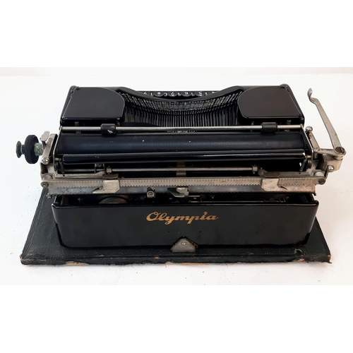 646 - A Vintage 1940s Olympia Progress Typewriter with Case. In worker order - case is slightly temperamen... 