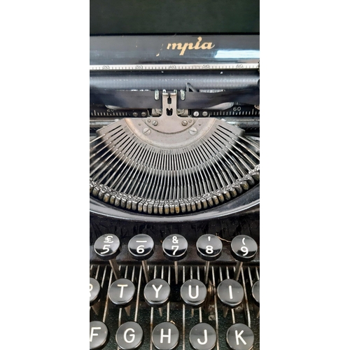 646 - A Vintage 1940s Olympia Progress Typewriter with Case. In worker order - case is slightly temperamen... 
