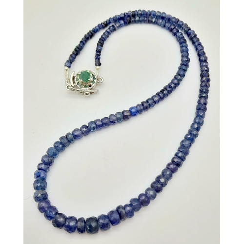 727 - A 110ct Blue Sapphire Necklace with an Emerald and 925 Silver Clasp. 40cm