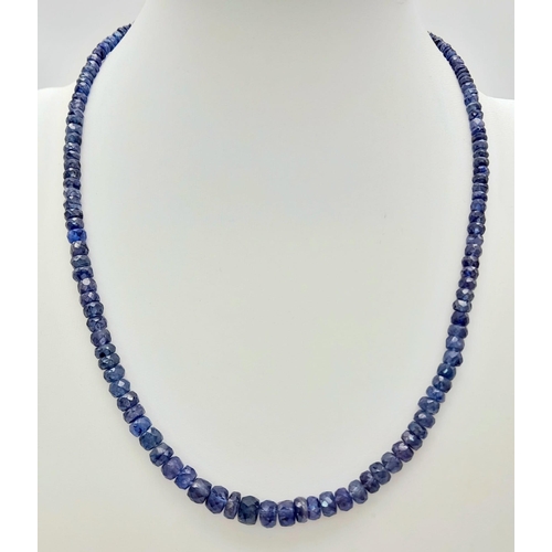 727 - A 110ct Blue Sapphire Necklace with an Emerald and 925 Silver Clasp. 40cm