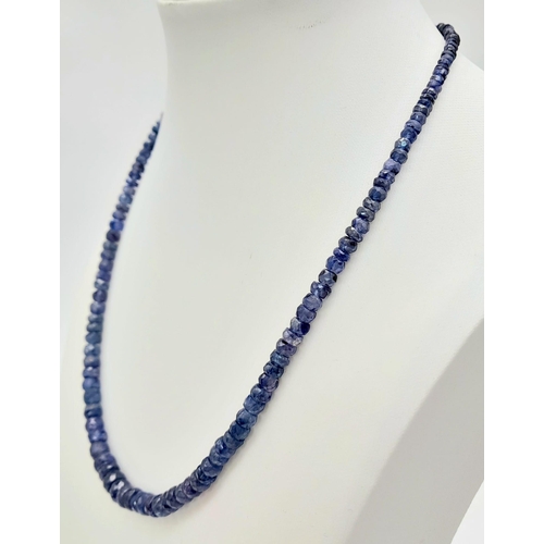 727 - A 110ct Blue Sapphire Necklace with an Emerald and 925 Silver Clasp. 40cm