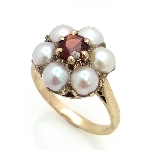 449 - 9k yellow gold pearl and garnet flower cluster ring (pearls:6x 5mm/garnets:0.60ct) 3.47g, size N