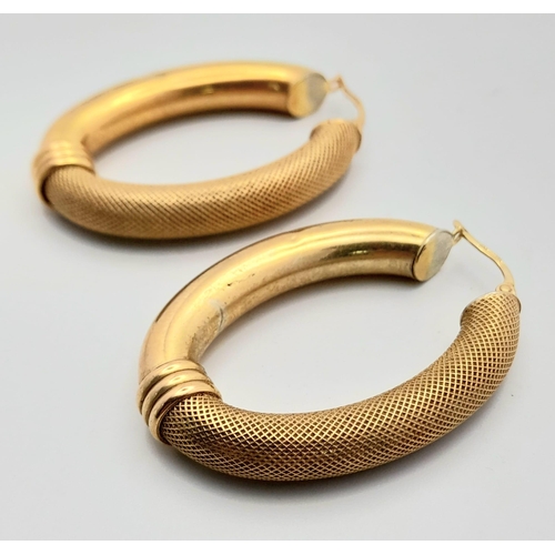 45 - Two Vintage 9K Yellow Gold Oval Hoop Earrings. Fine mesh decoration on one side. 5.5g total weight