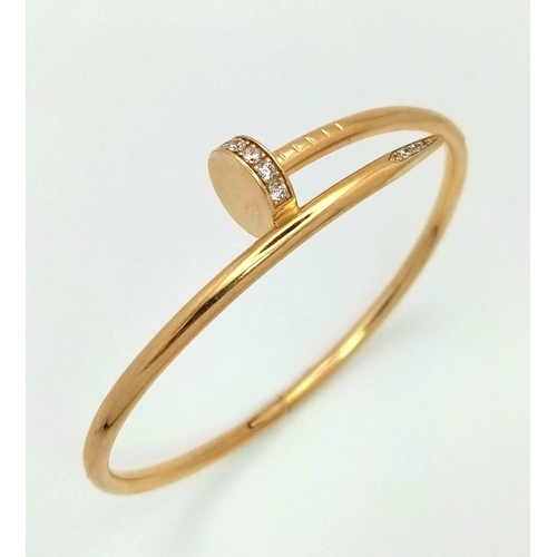 54 - 18K YELLOW GOLD CARTIER STYLE STONE SET NAIL BANGLE. TOTAL WEIGHT 10.5G