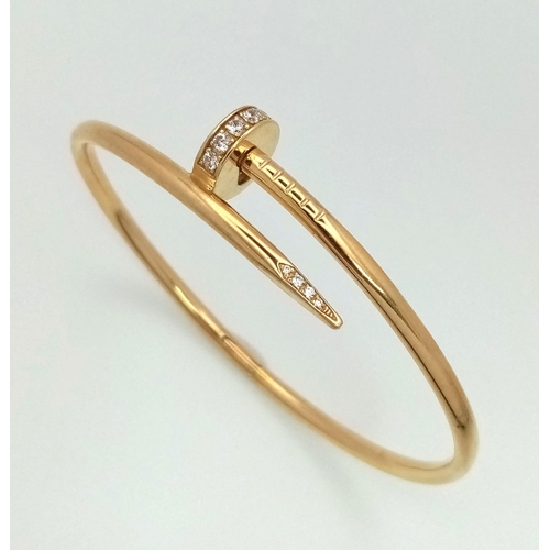 54 - 18K YELLOW GOLD CARTIER STYLE STONE SET NAIL BANGLE. TOTAL WEIGHT 10.5G