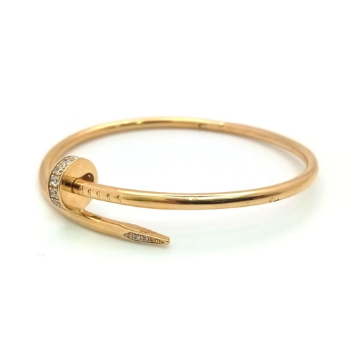 54 - 18K YELLOW GOLD CARTIER STYLE STONE SET NAIL BANGLE. TOTAL WEIGHT 10.5G