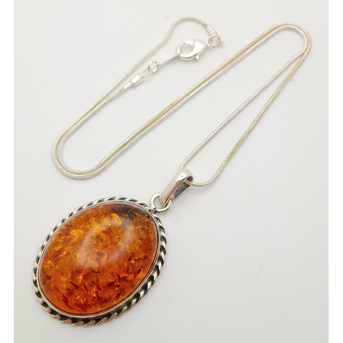 611 - A Vintage Large Silver Amber Cabochon Pendant Necklace. Pendant measures 5cm Drop from 46cm Sterling... 