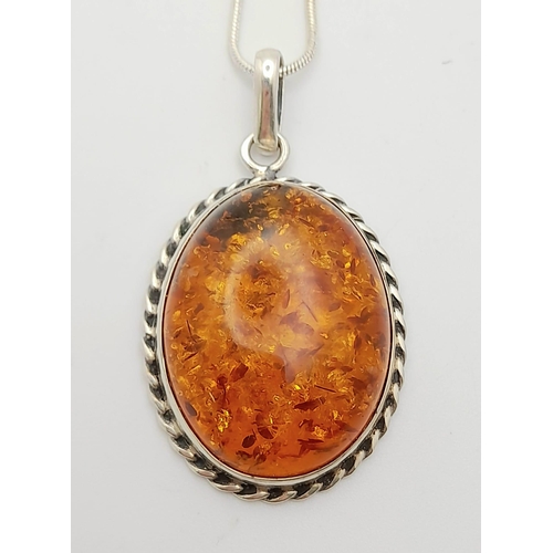 611 - A Vintage Large Silver Amber Cabochon Pendant Necklace. Pendant measures 5cm Drop from 46cm Sterling... 
