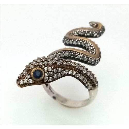 935 - A 925 Silver Snake Ring with White Stone Decoration. Size O.